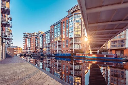 birmingham canal with a bridge and modern properties